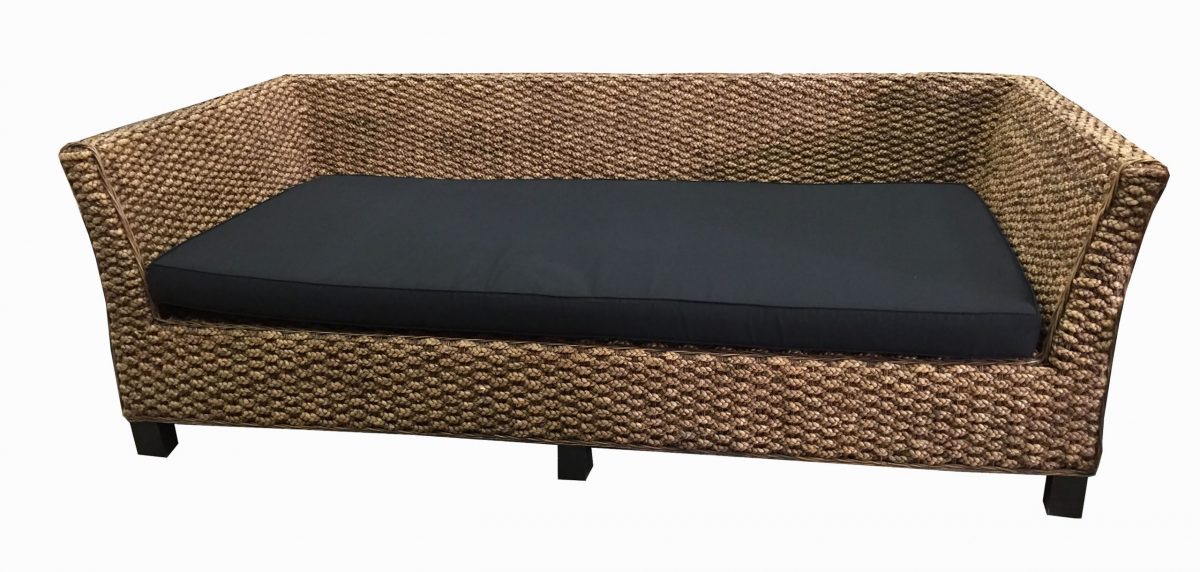 Rattan-style sofa with black cushion