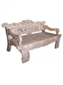 Carved wooden bench with ornate design