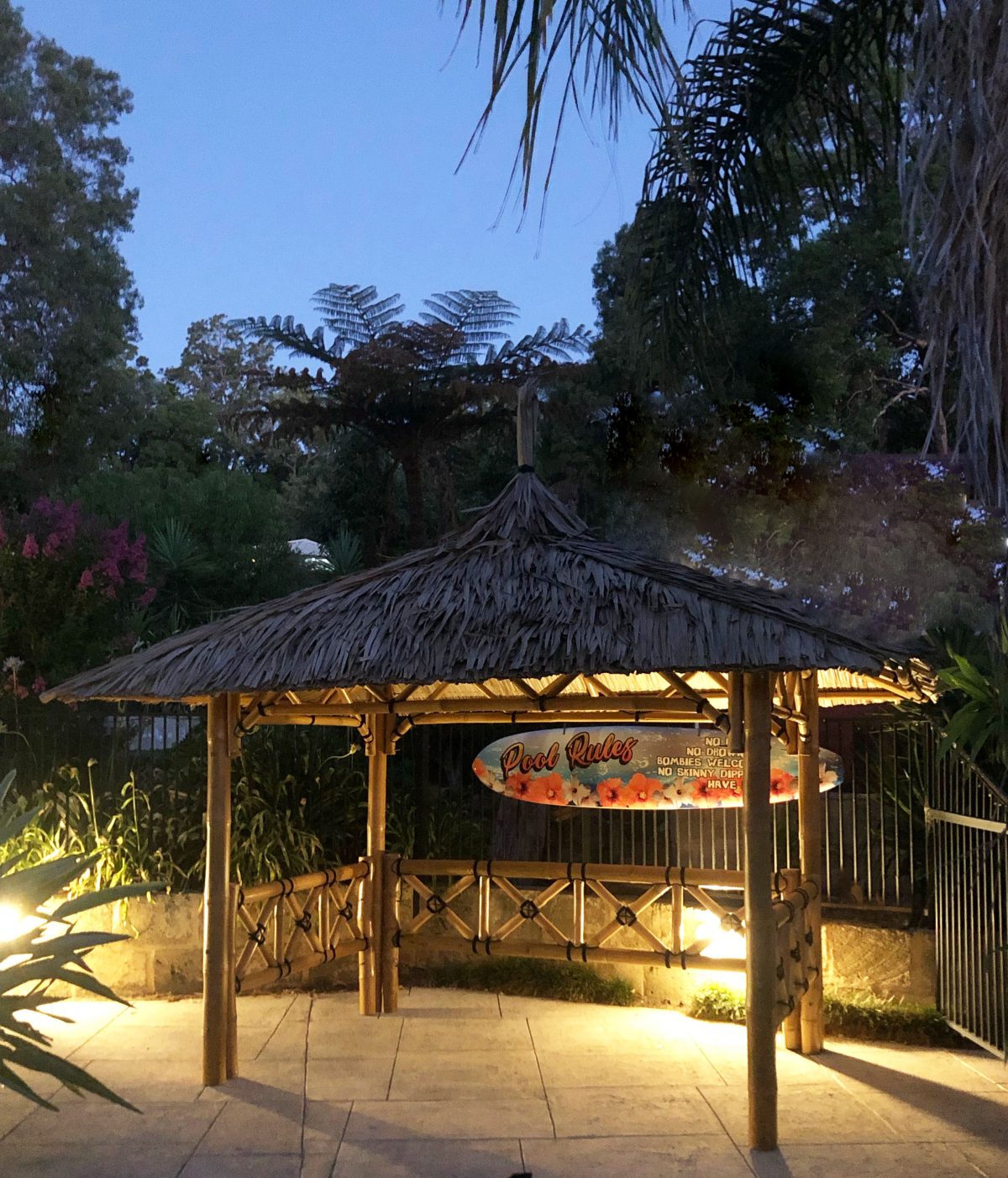 Thatched roof gazebo at dusk