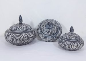 Set of three decorative pots with spiral design